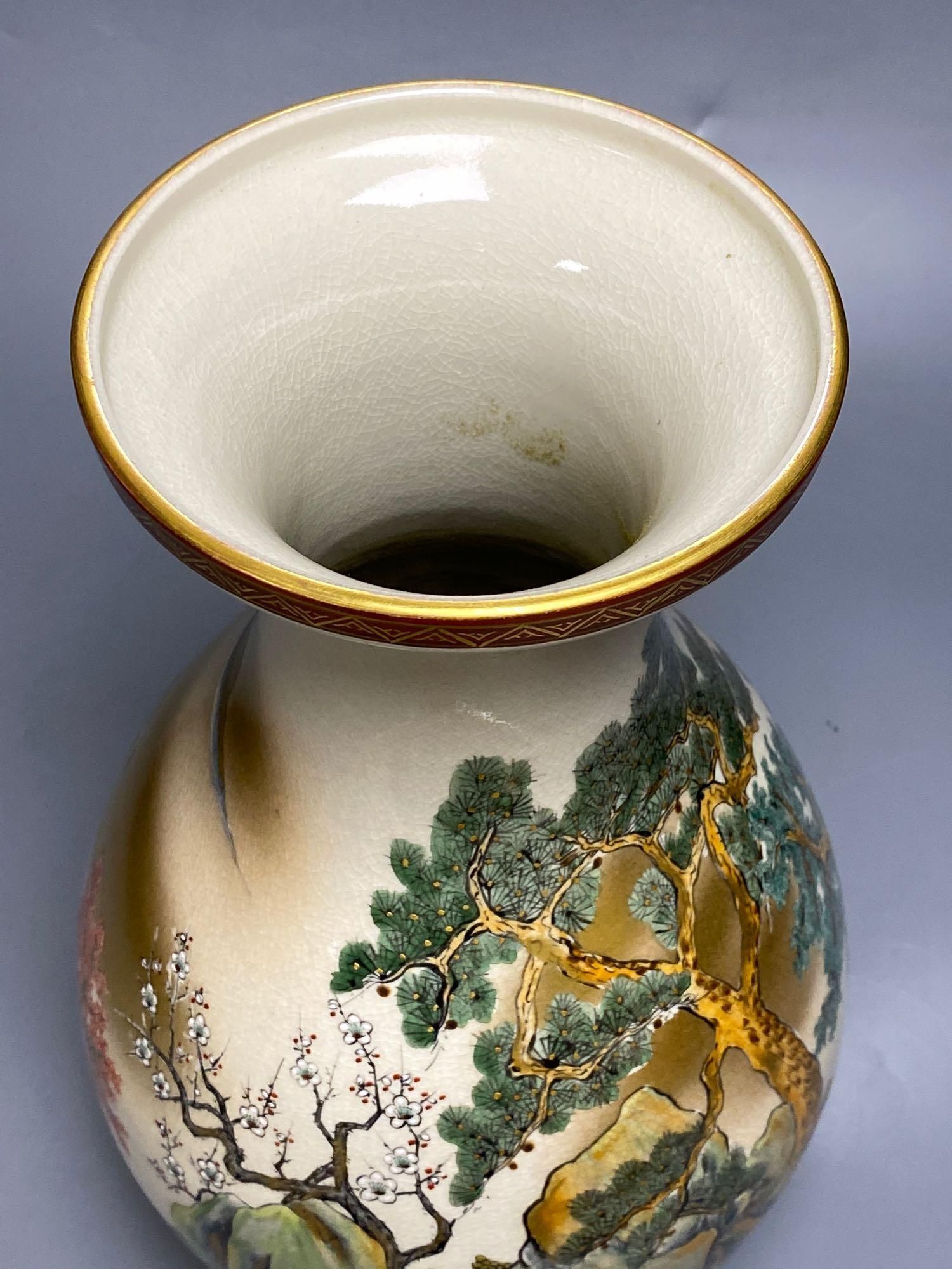 A pair of Japanese satsuma baluster vases, height 46cm, and a satsuma bulbous vase, height 37cm